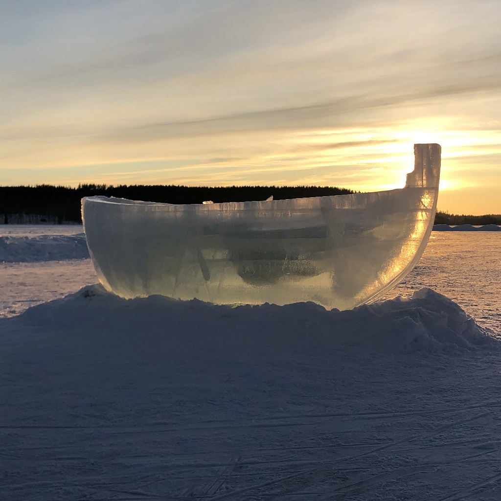 Ice sculpture of a boat on a lake in Lapland
