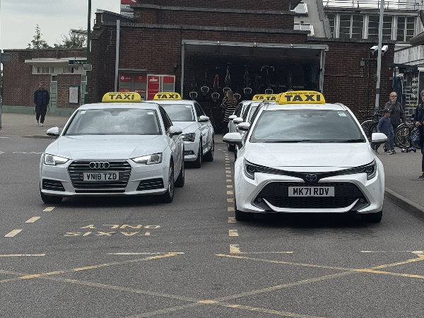 Two White Taxis